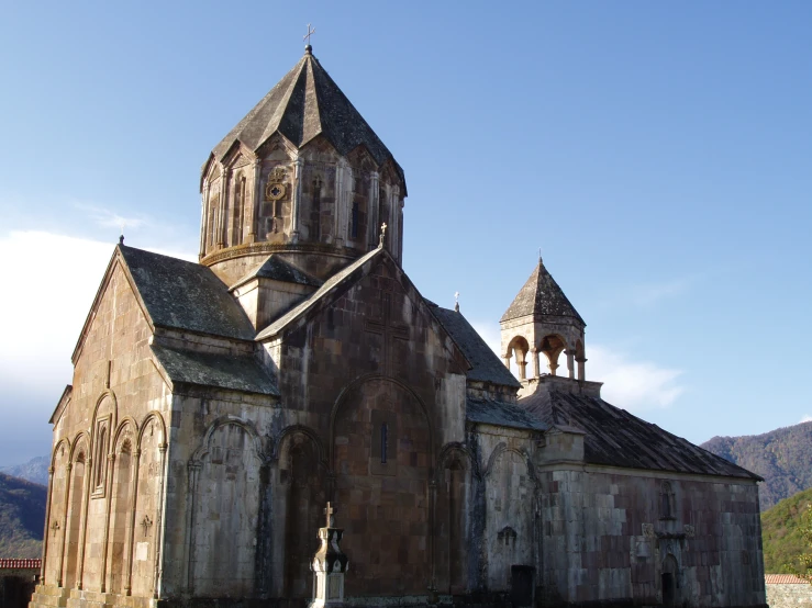 an old, abandoned church stands near the mountains