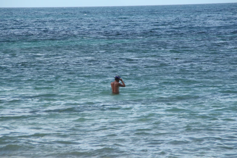 a person in the water with one arm around each other