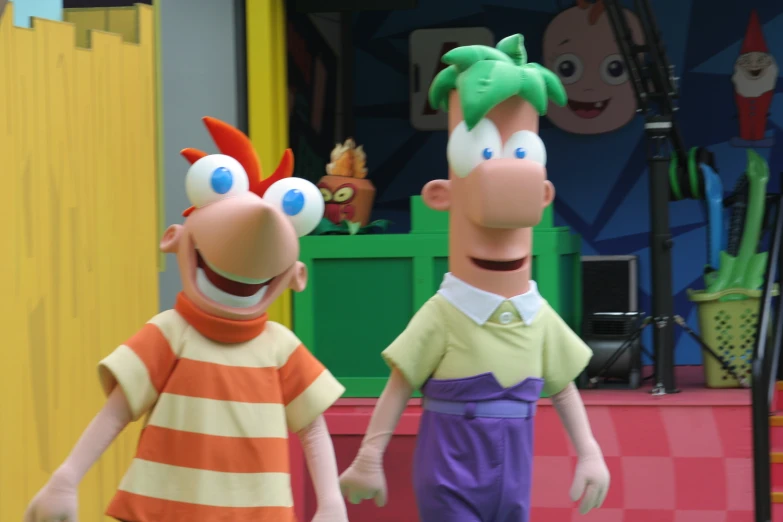 two puppets of cartoon characters holding hands