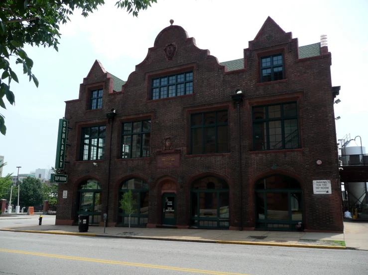 an old brick building sitting along the side of the road