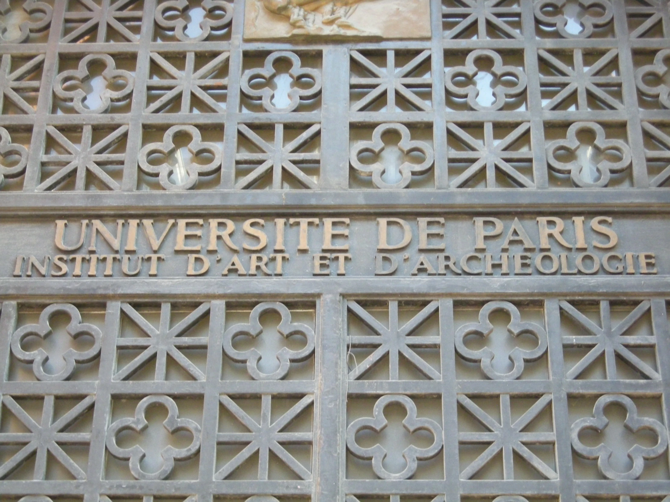 a close up view of an ornate iron door