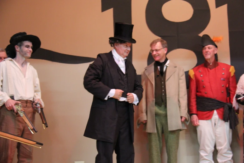 men in fancy costume performing in front of a crowd