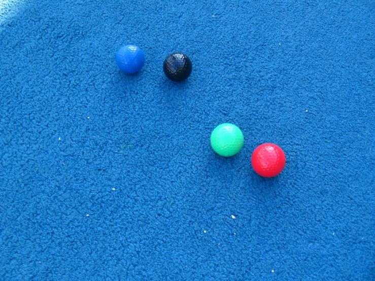 several different balls in a small patch of blue
