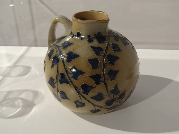 an old, white vase has stars painted on it
