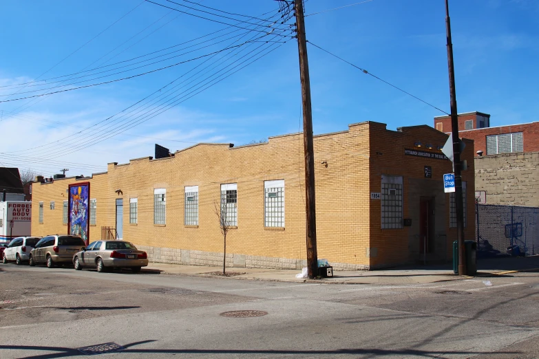 a view of a parking lot next to an old building