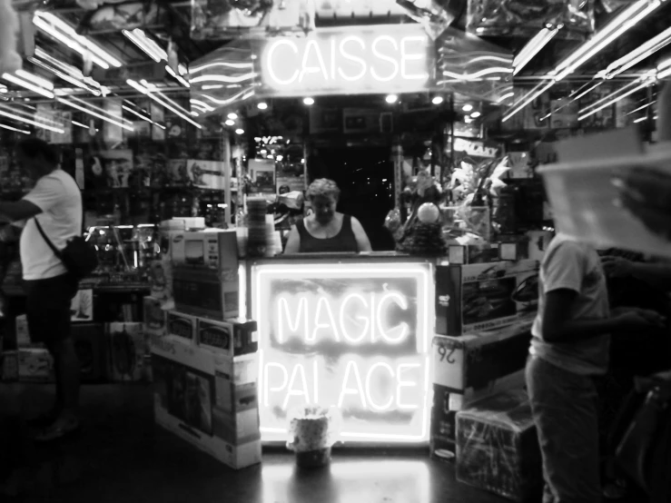 a sign that reads oasis, magic palace at night