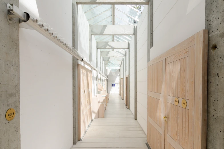 a view down an empty hallway with rows of doors