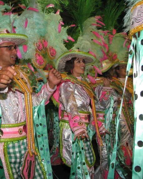 men and women in colorful costumes and hair