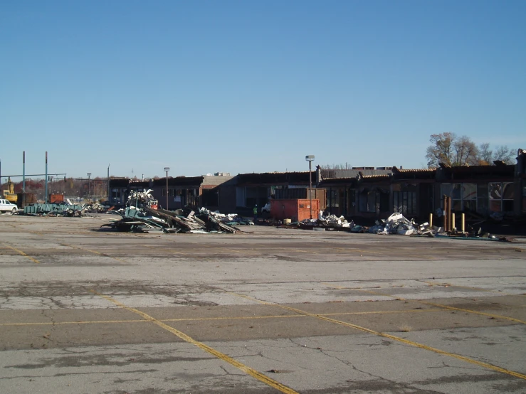 a vacant commercial lot with multiple old buildings in the background