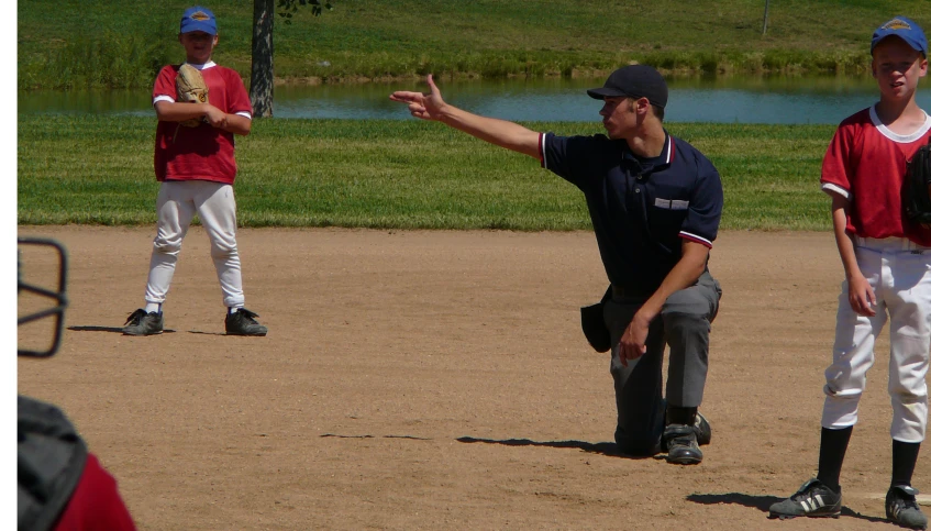 a couple of baseball players on the pitchers mound