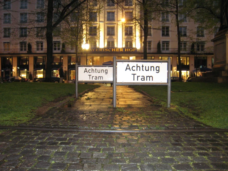 two signs reading nothing right, acting tram and acting tram on the same side