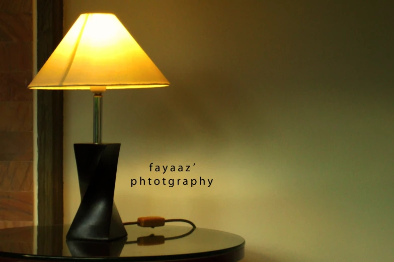 lamp on table near wall and lamp captioned with name