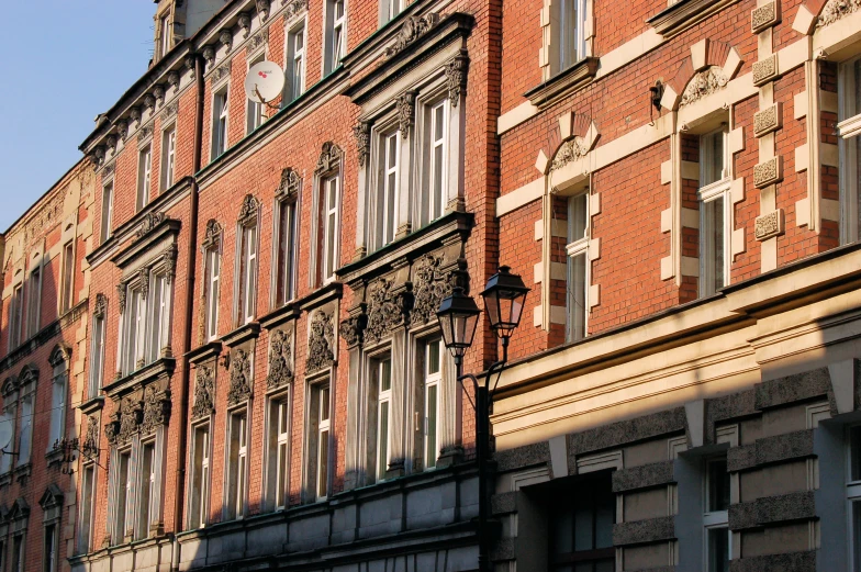 a building made of brick with some clocks on it