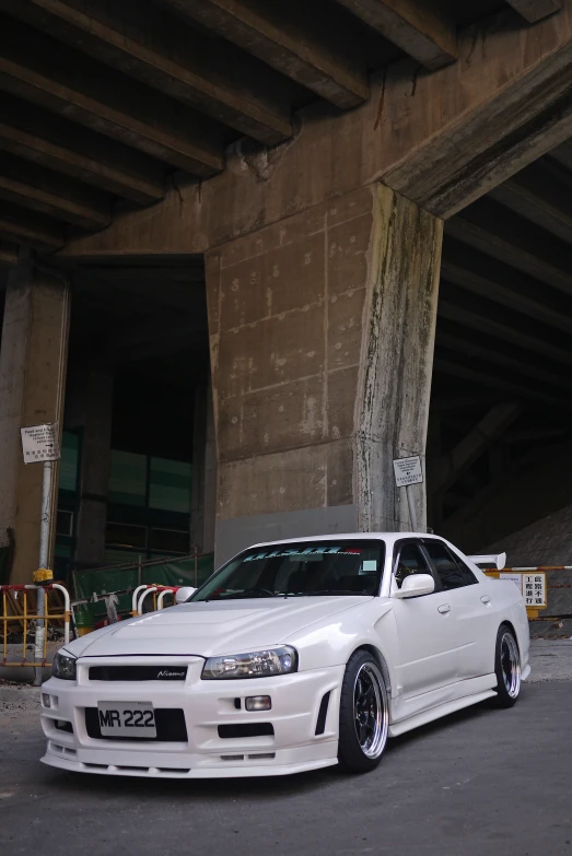 a white car parked in front of a building