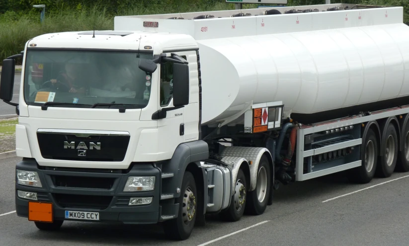 large trucks hauling cement down the road