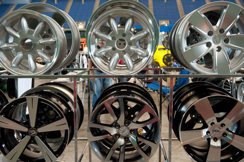 a set of new wheels are being held up by a metal rack