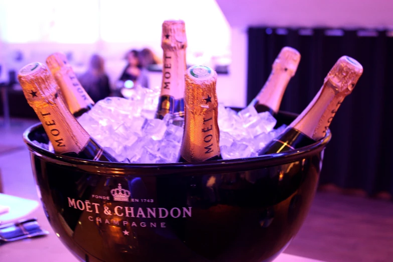 a bucket filled with champagne bottles on top of ice