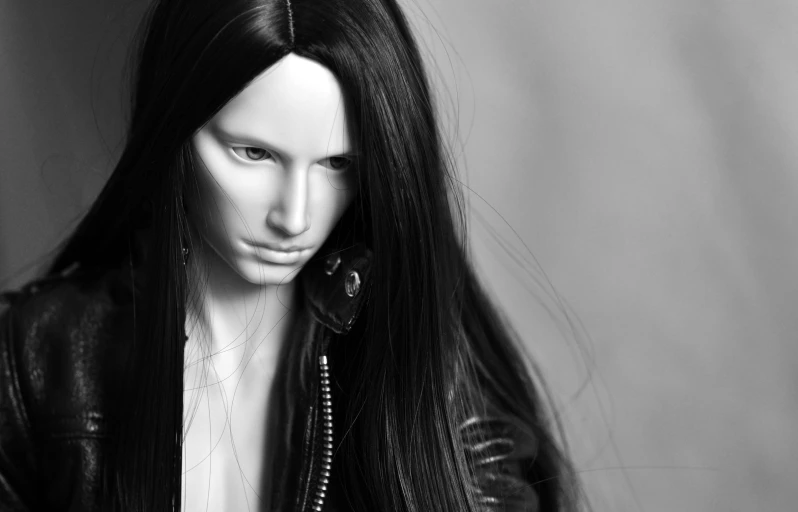 a close up image of a fake person with long black hair