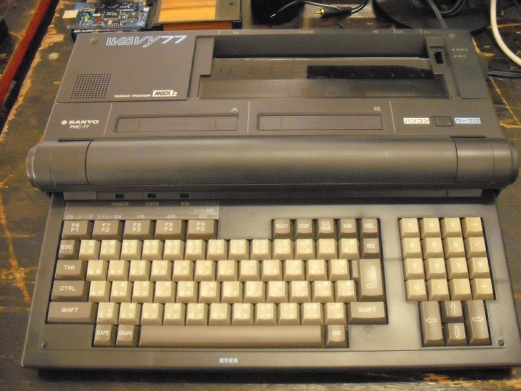 an old computer is sitting on a workbench