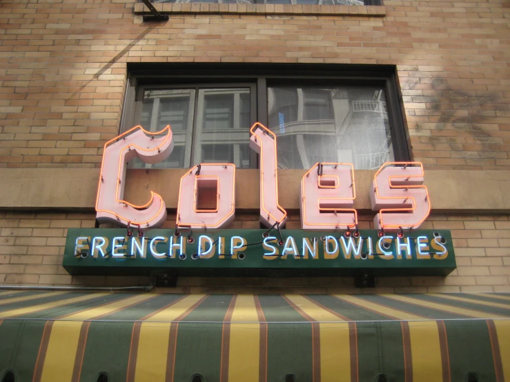 an old sign for a restaurant called coles