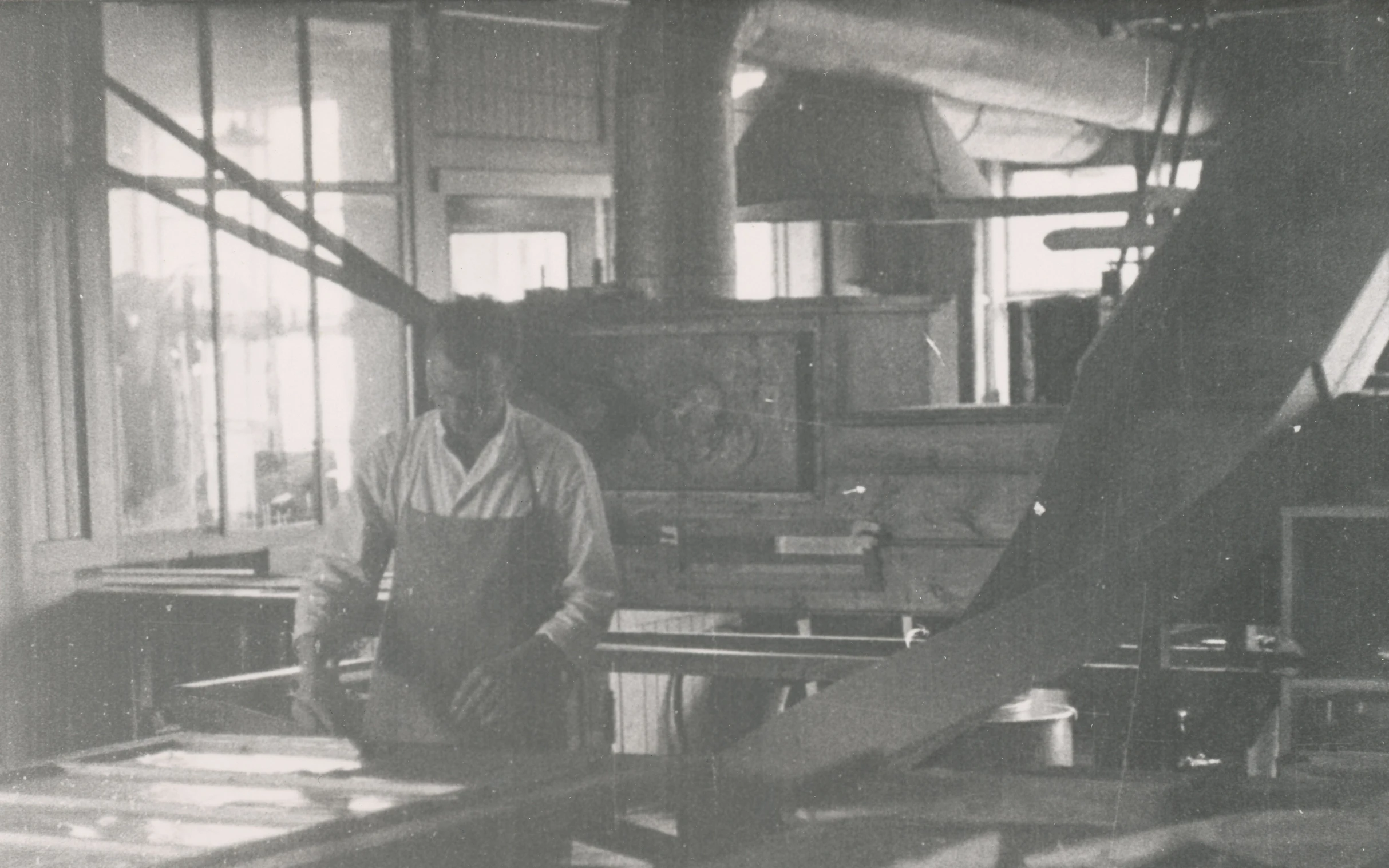 a man is working in a woodworking shop