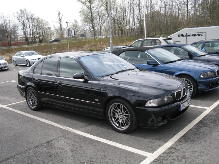 several cars are parked in an empty parking space