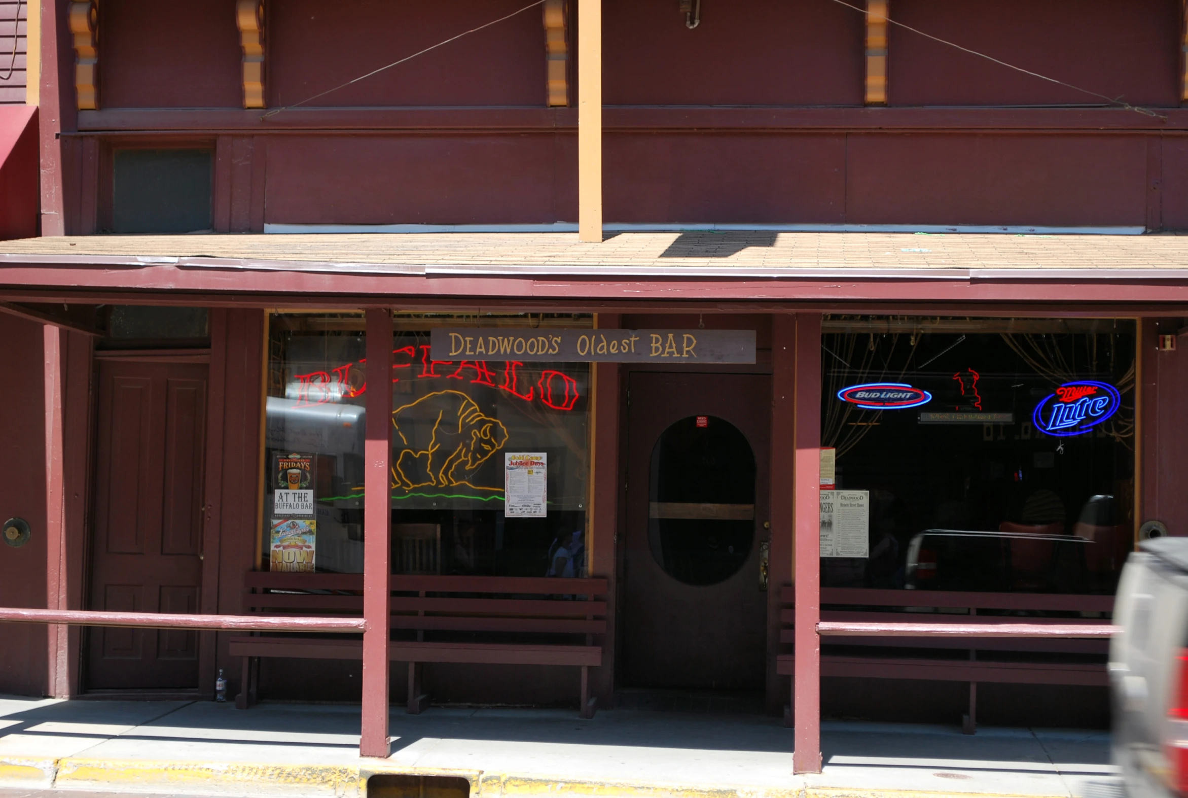 a store front is open with some signs