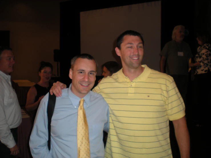 a couple of people in shirts and ties