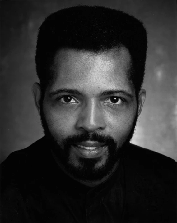 a black and white po of a man with a beard