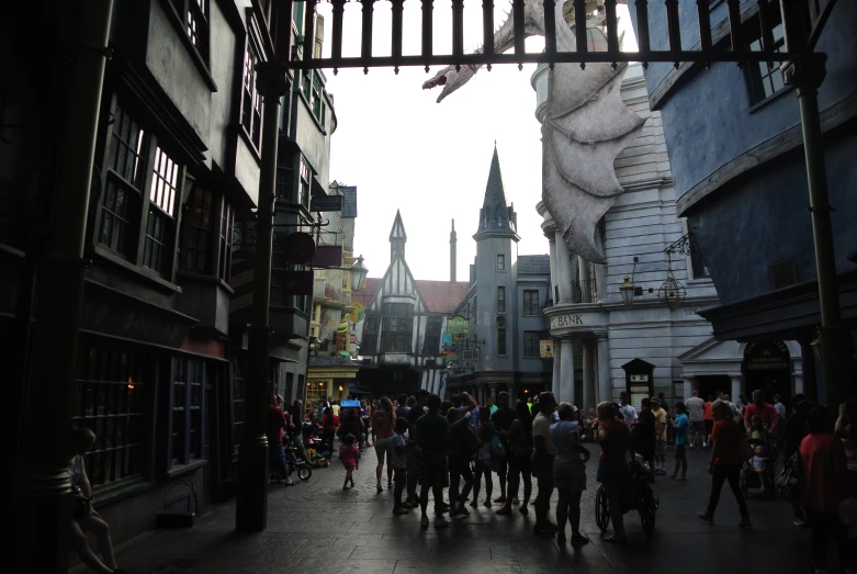 people walking down an alley way with tall buildings