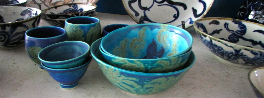 a number of bowls on top of a table