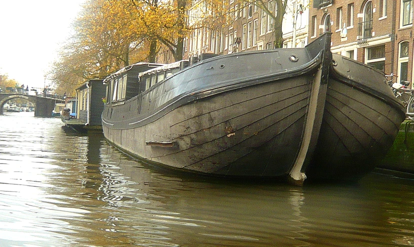 a large boat on the side of a river