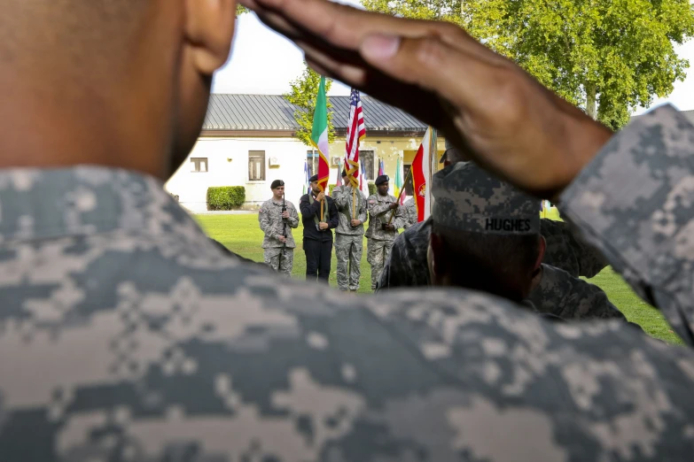 the american soldier salutes at a medal ceremony