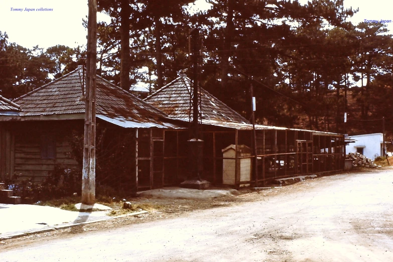 an old, run down shack has two towers