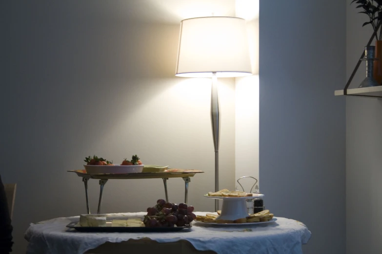 the dessert is placed on a table by a lamp