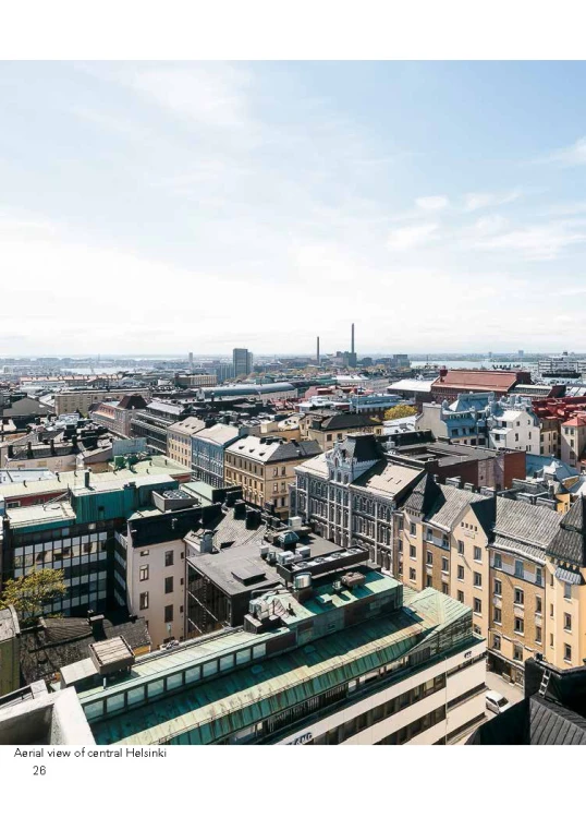 an overhead view of the city and buildings with the water in the background