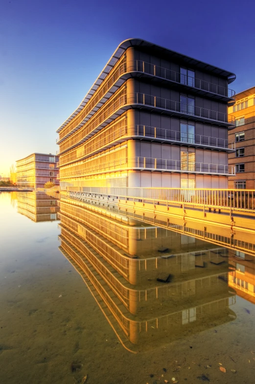 a large building sitting next to some water