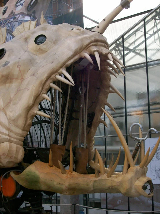 a display of an animal, with one mouth open and another with long spikes and fangs