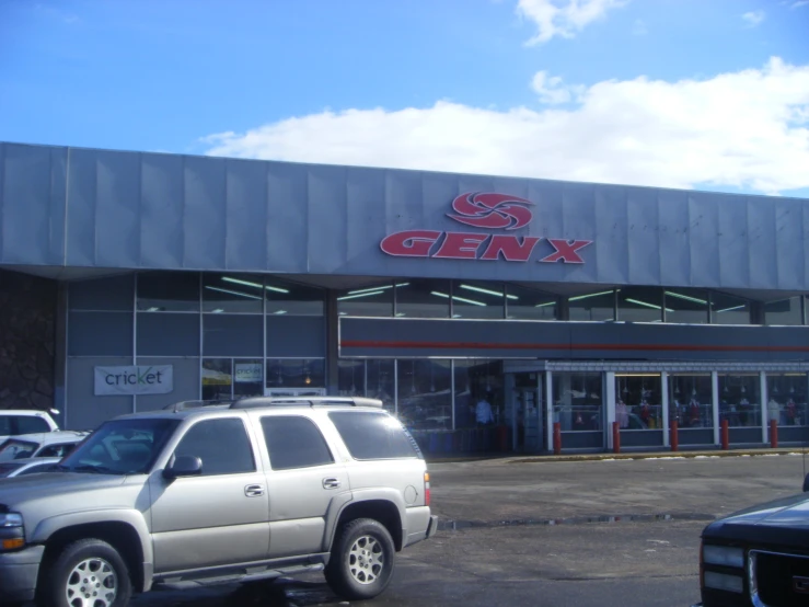 a truck that is parked outside of a car store