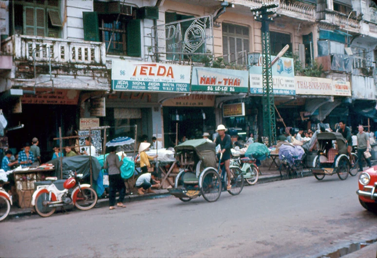 lots of people outside stores on the street