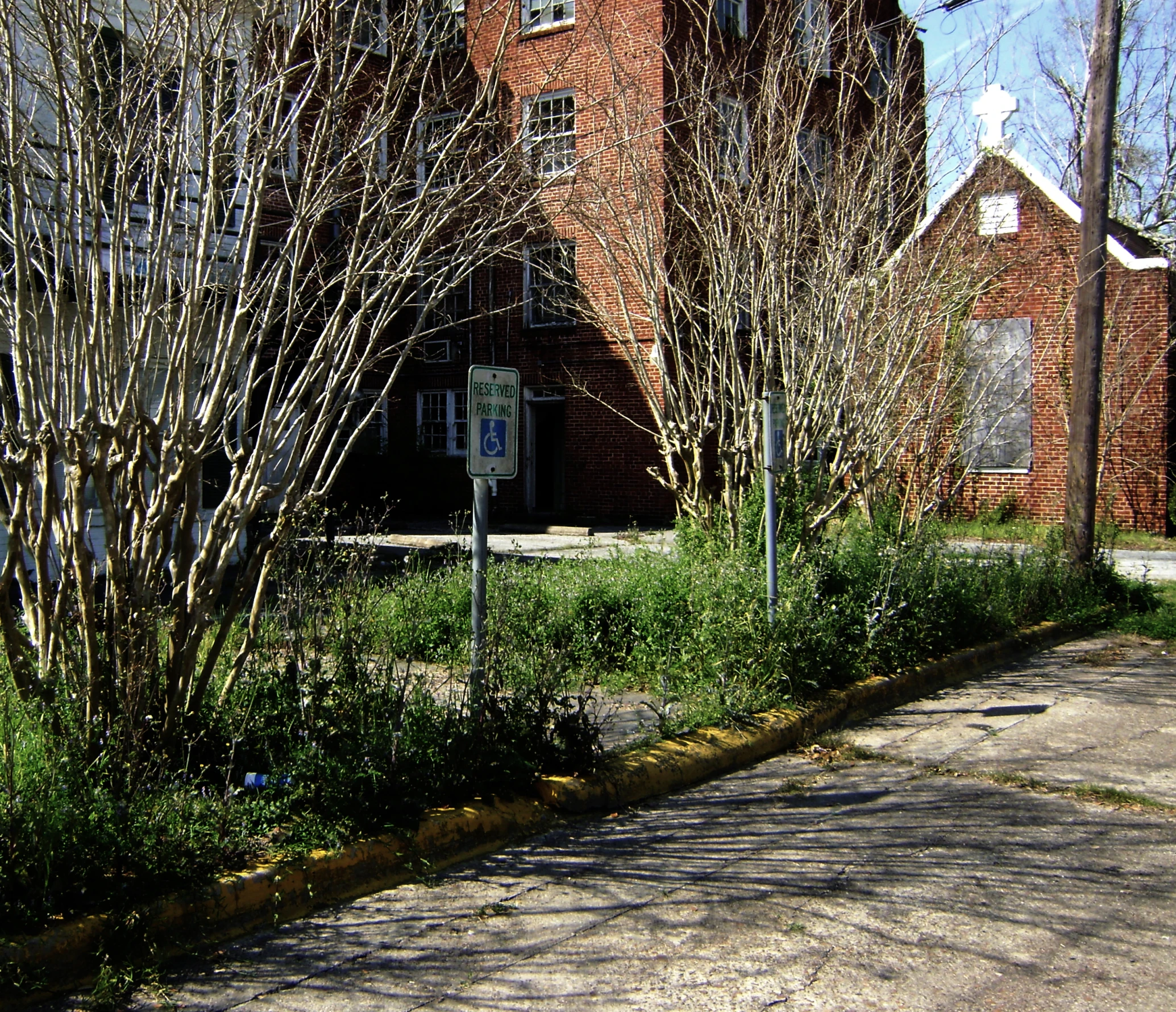 a red building sits by the side of a road