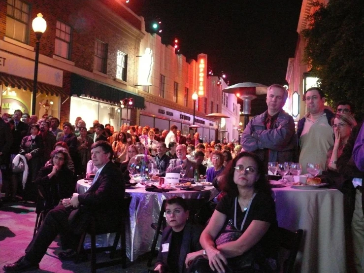 a group of people who are sitting in a row