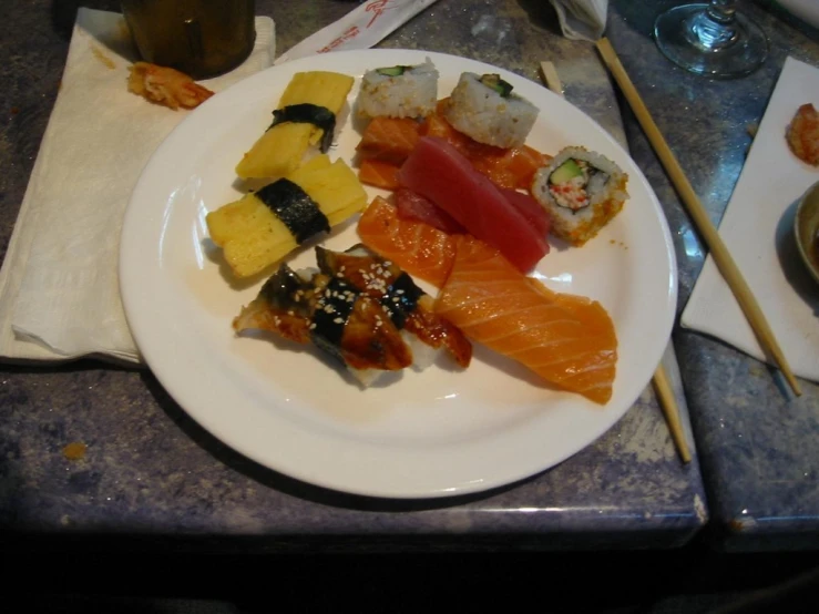 some different types of sushi on a plate