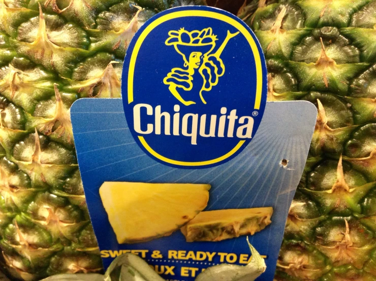 an ad showing sliced pineapples and pieces with words chuquita