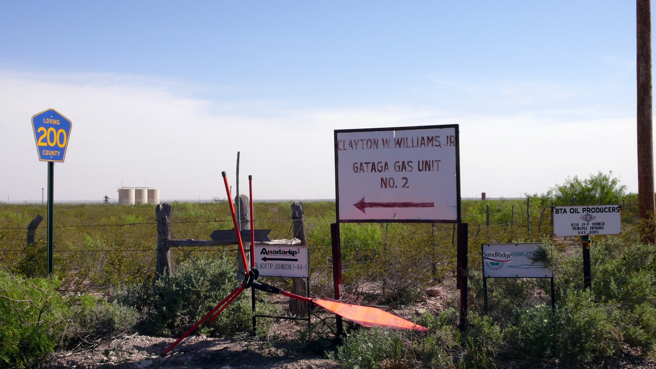 some signs with writing and arrows on them