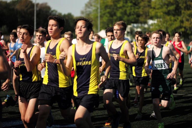 the men are running on the field in their uniforms