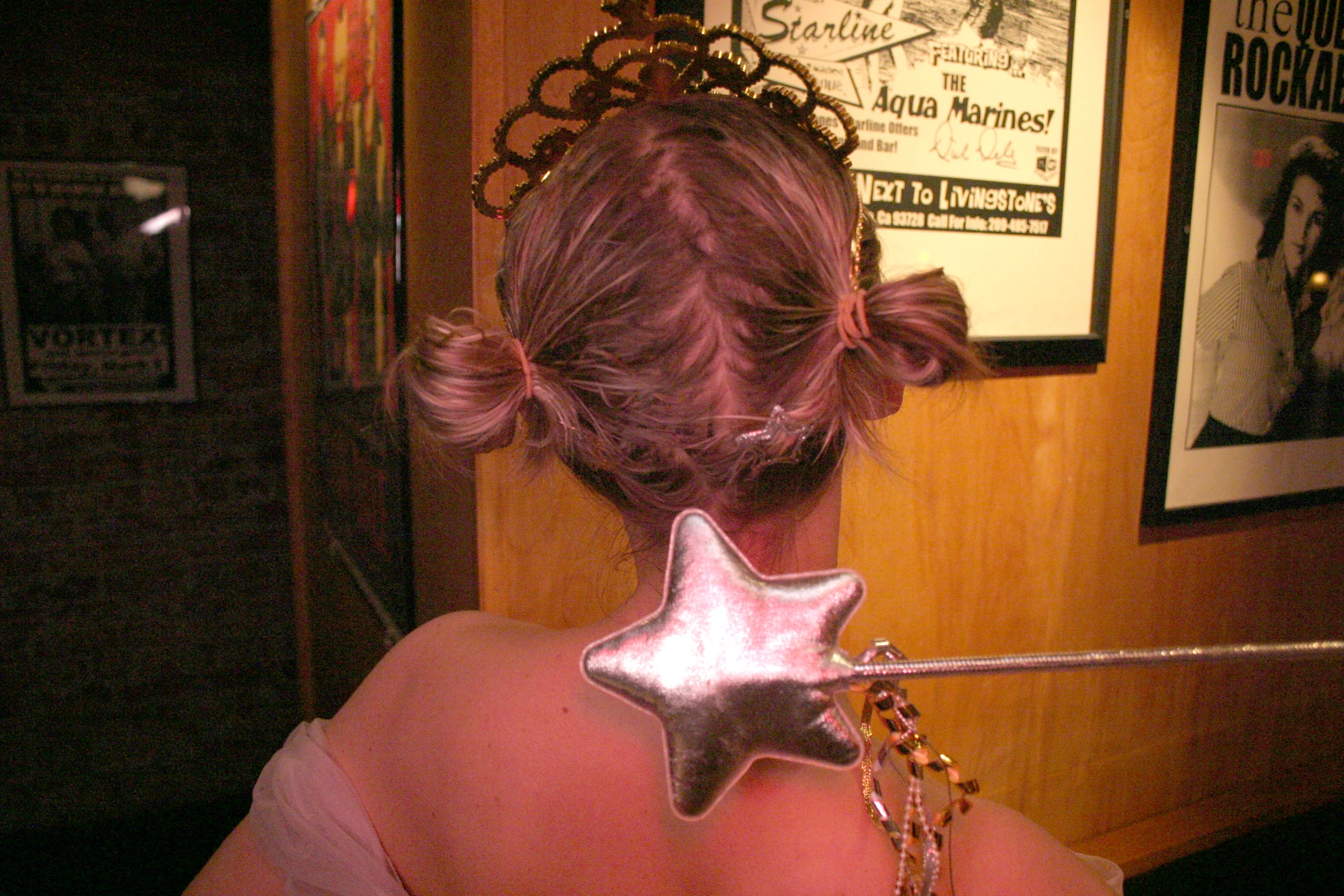 a woman wearing a metal star clip in her back