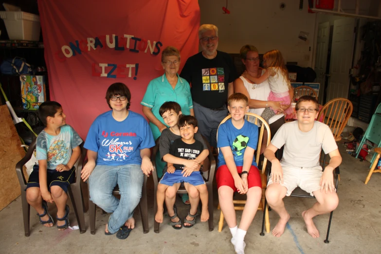 group of children pose for po with their teacher