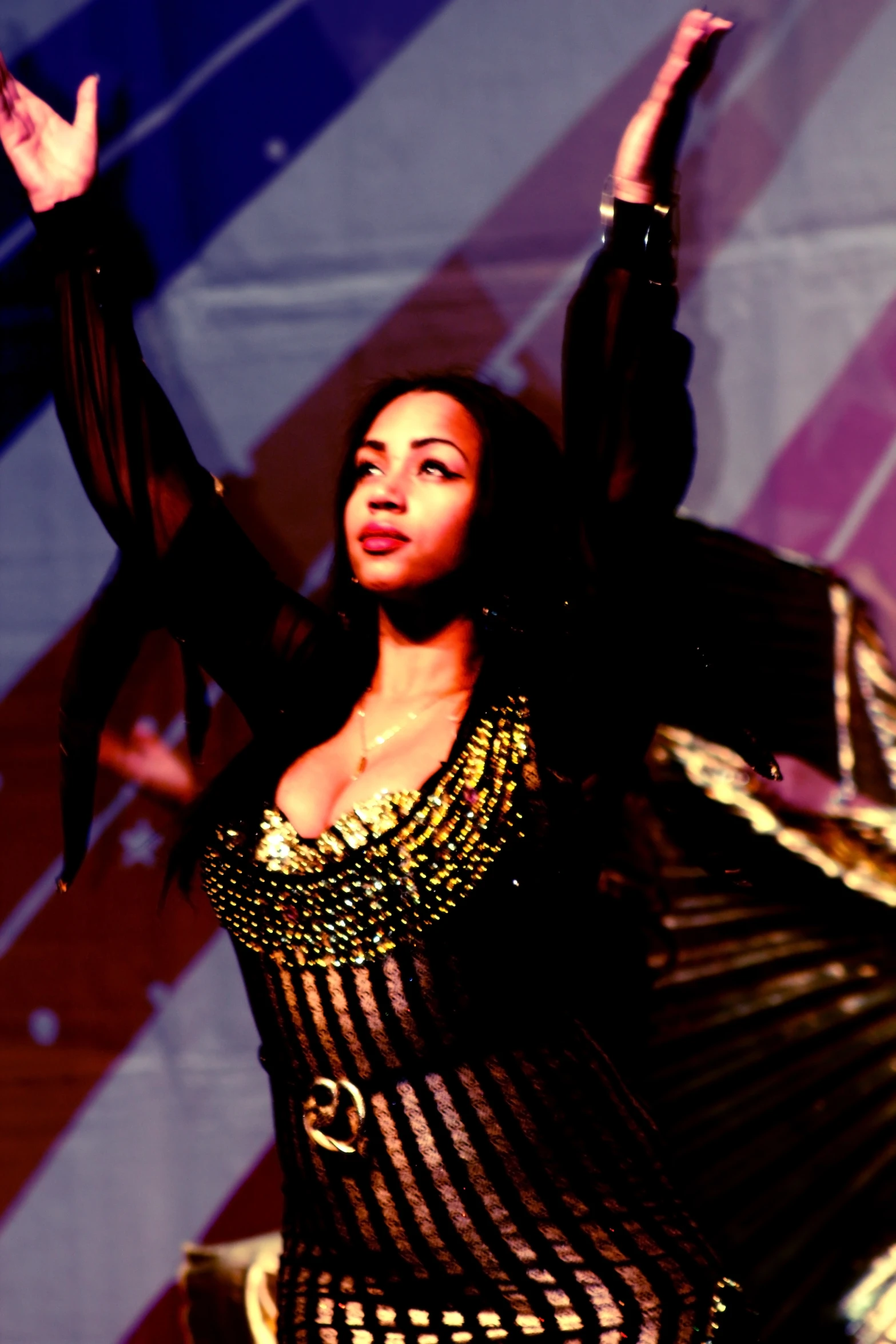 a black woman in a costume on stage