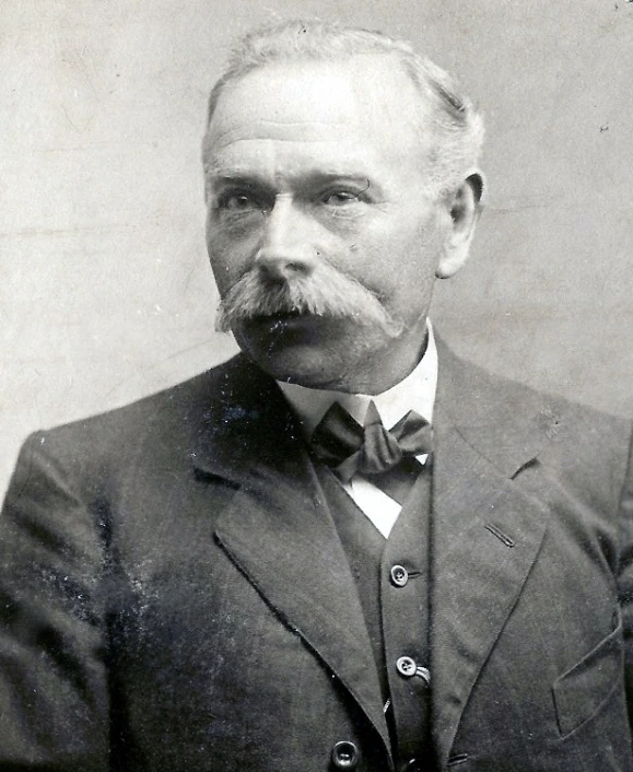 old black and white pograph of a man with a goatee